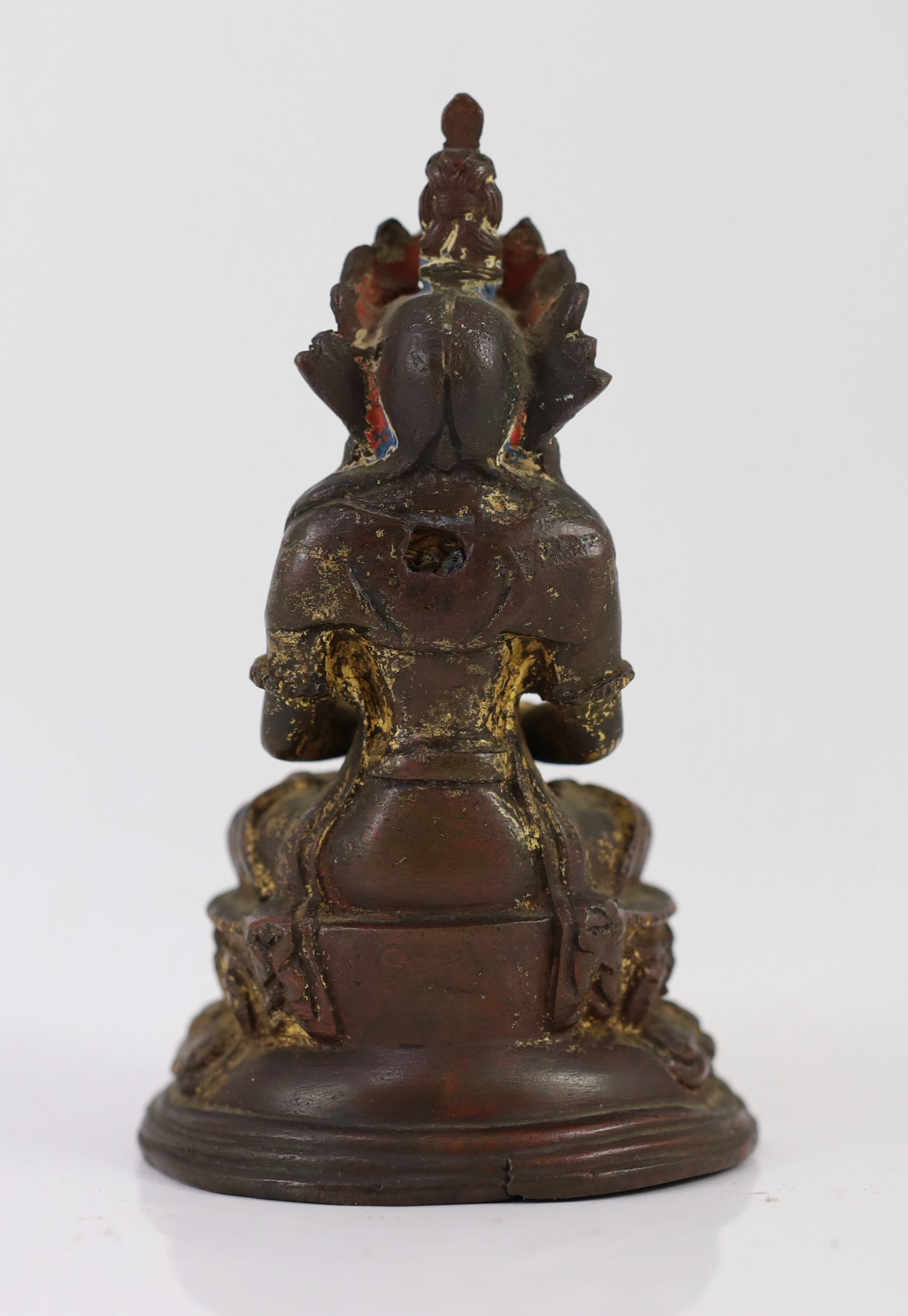 A Tibetan gilt copper alloy figure of Amitayus, 16th/17th century, 14cm high